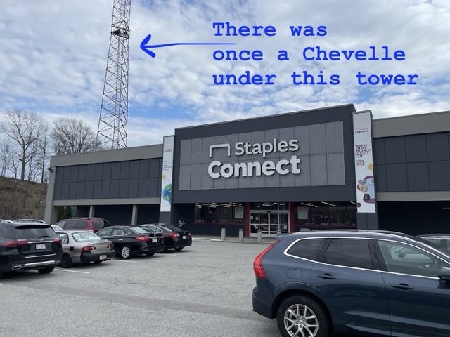 Staples with the radio tower visible in the background